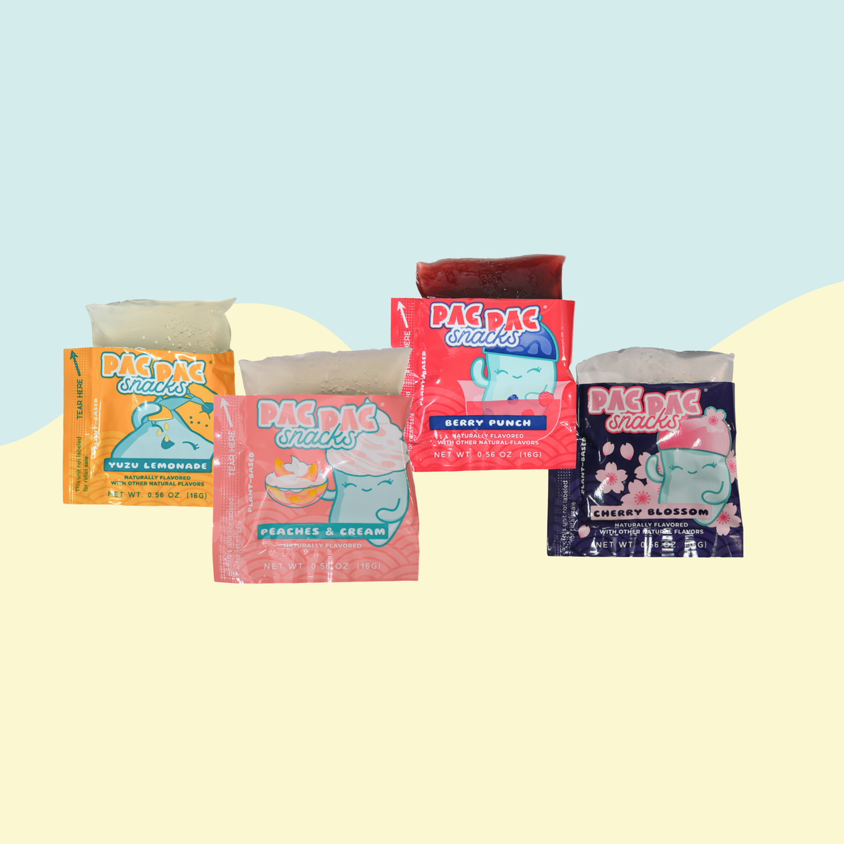 4 sachets of Pac Pac konjac jelly with jelly peeking out, in each flavor, on a bicolored teal and yellow background. 